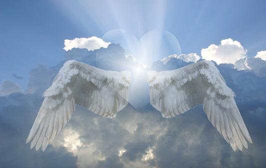 Angel number wings with blue sky and sun rising